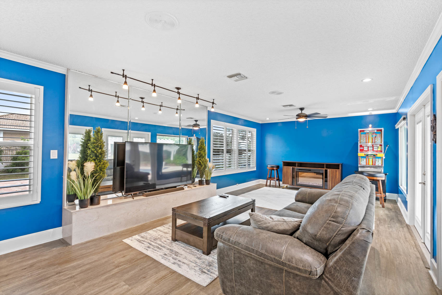 room with bright blue walls and couches